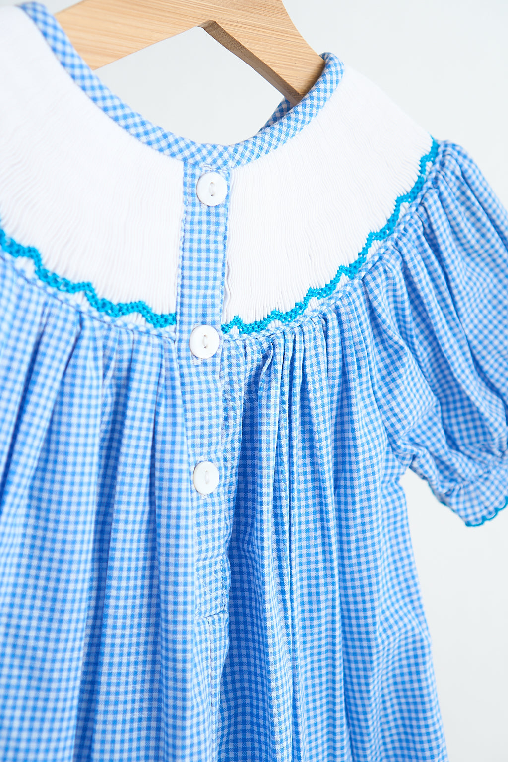 Blue snow princess hand smocked gingham girl romper